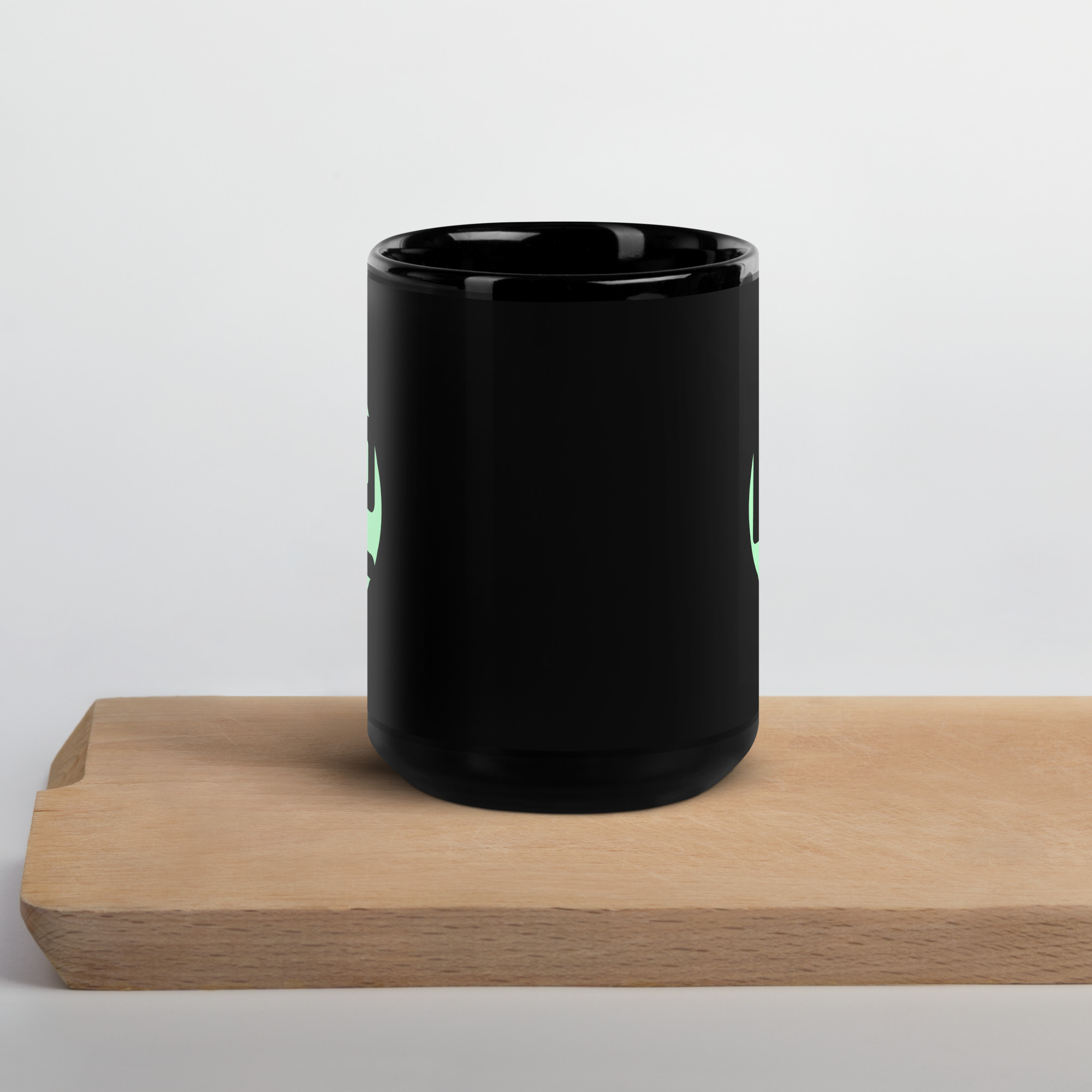 black glossy mug Black mug with green design